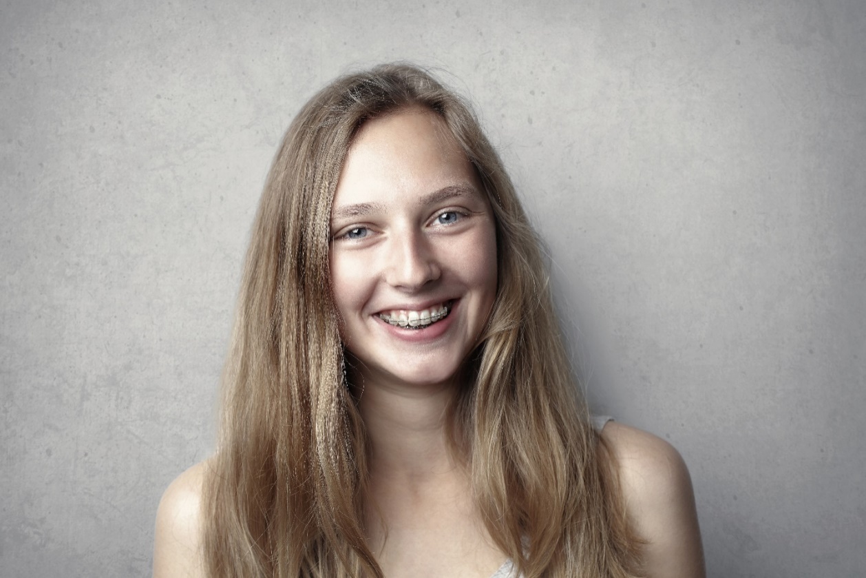 A smiling girl with braces
